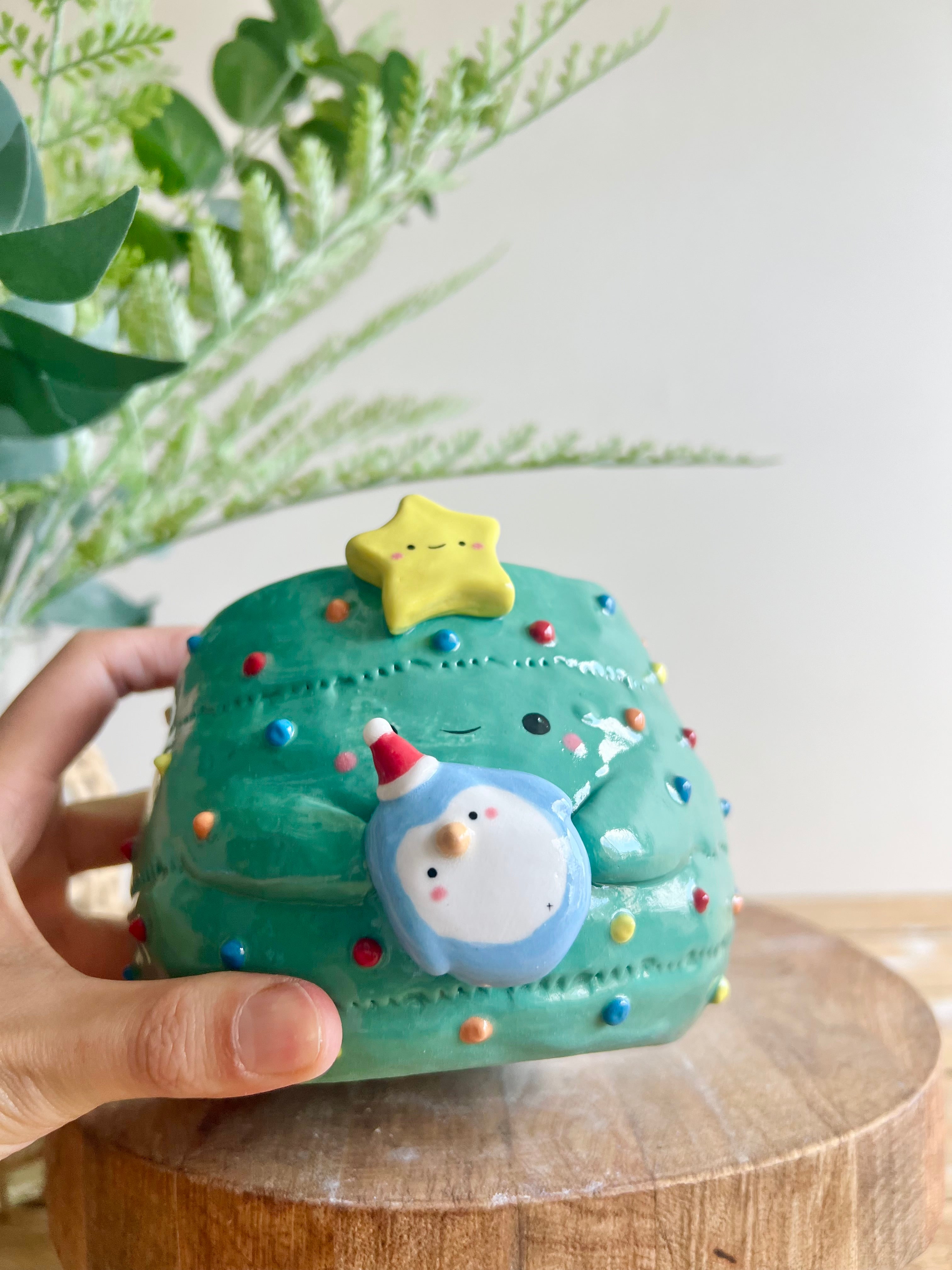 Christmas tree pot with penguin friend