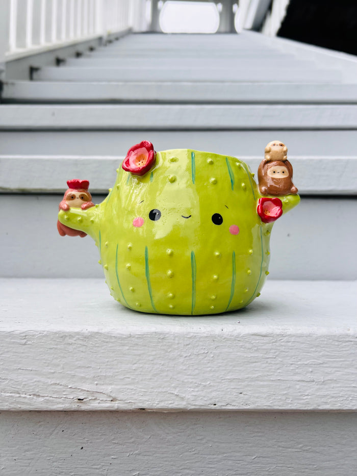 Flowery cactus pot with sloth friends