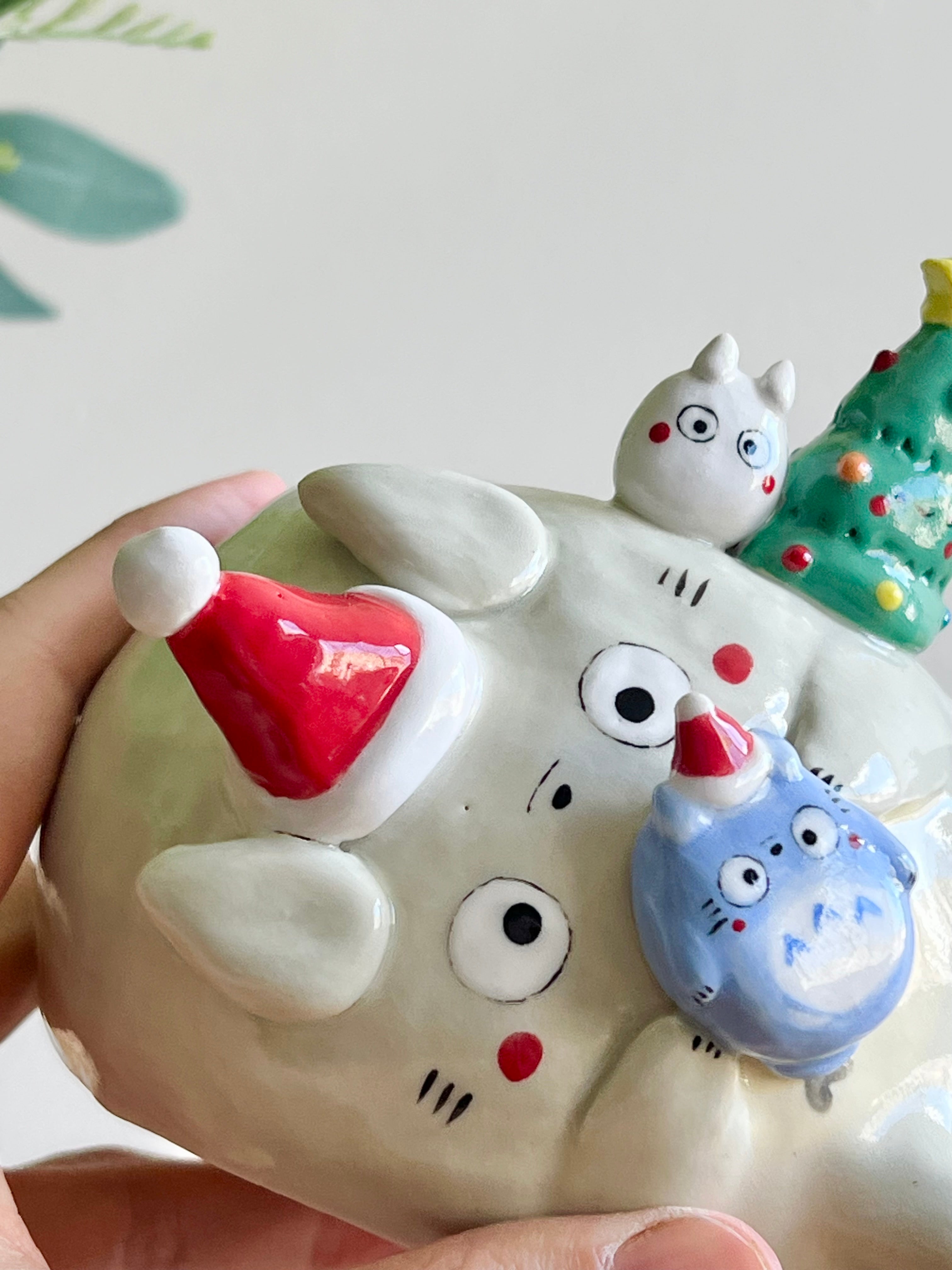 Festive sideways Totoro vase