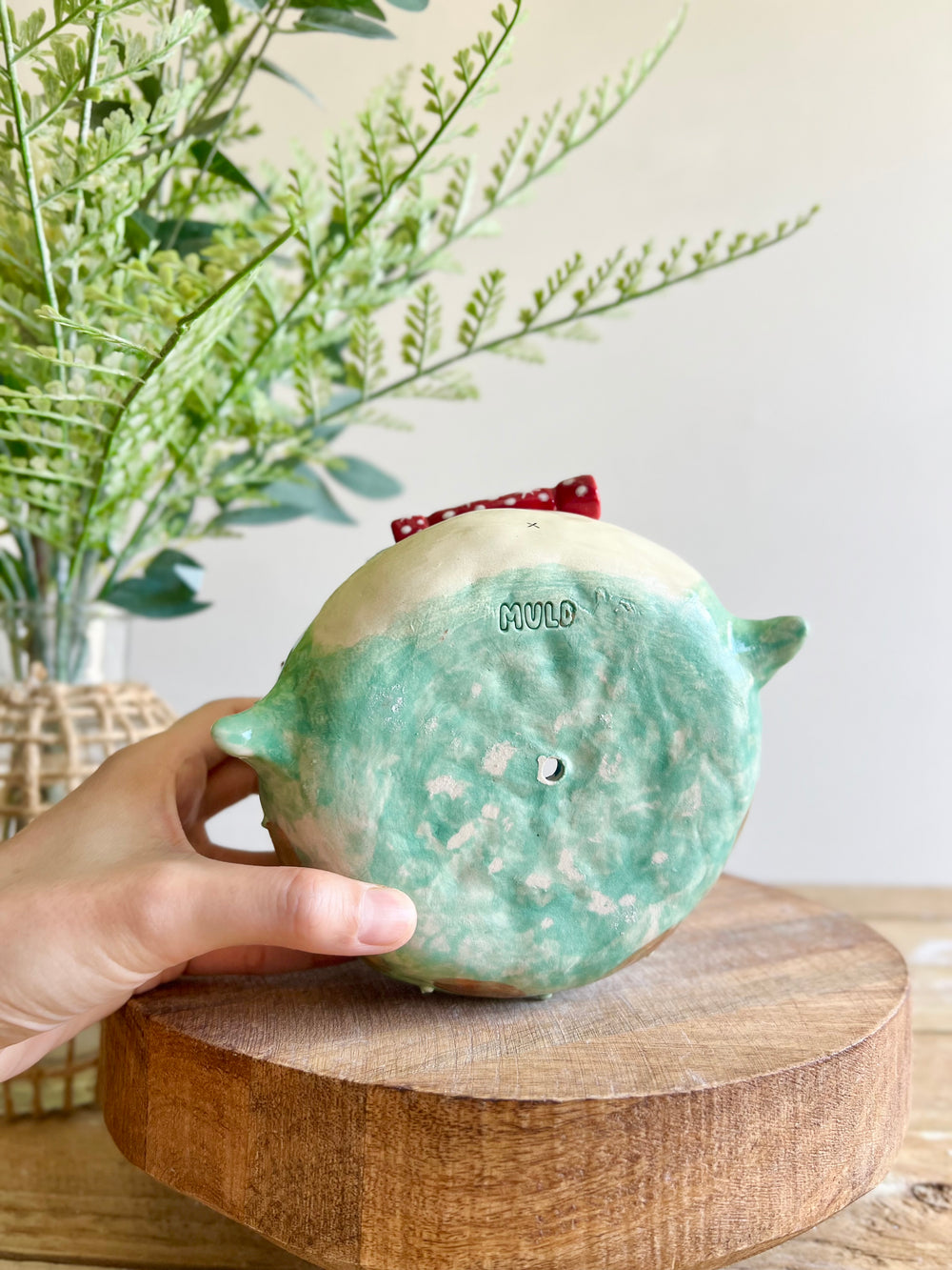 Festive grumpy Froggo planter cracks bon bon with you, photo 11 of 12