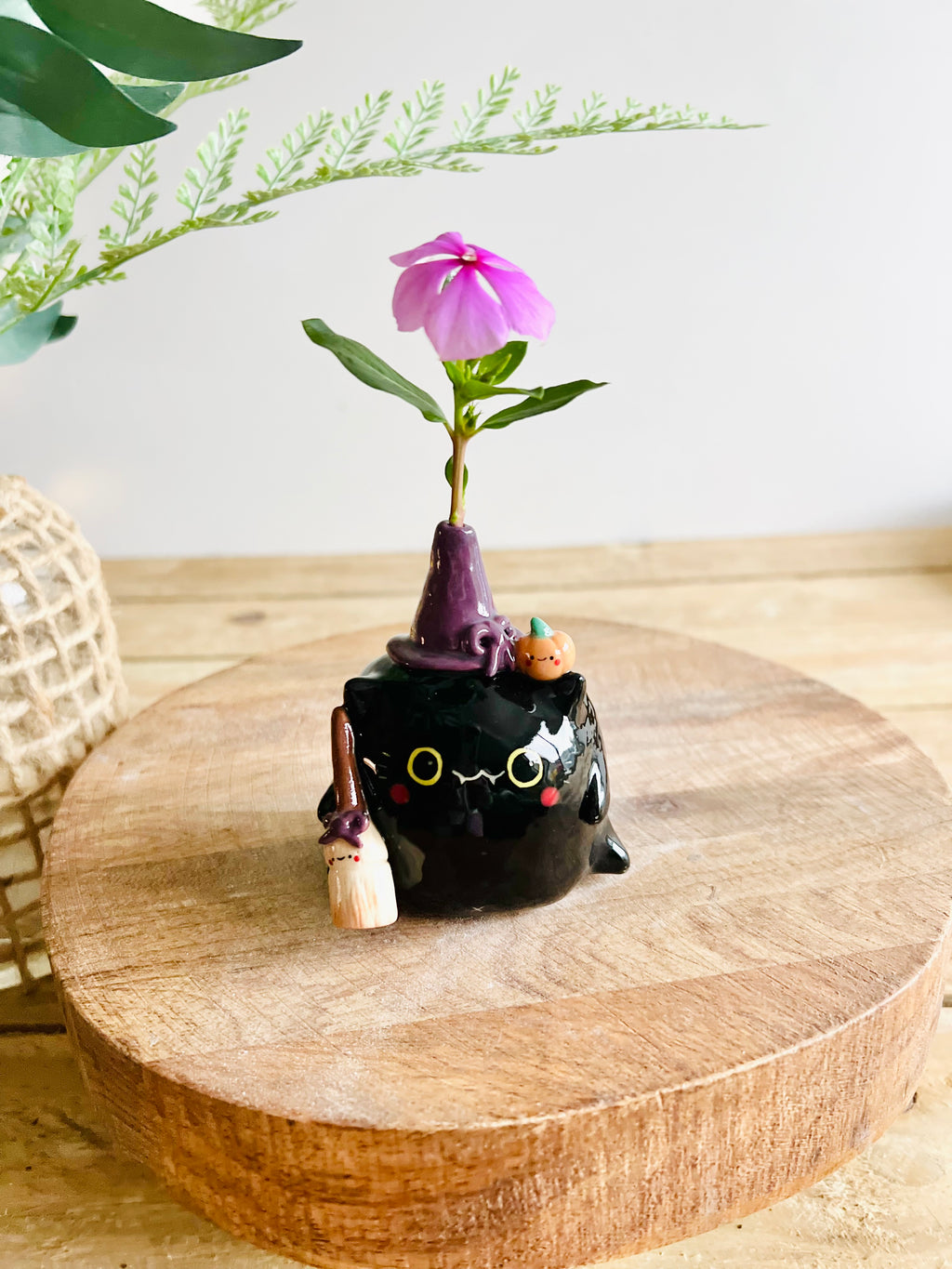 Black cat witch with broomstick and pumpkin friend bud vase