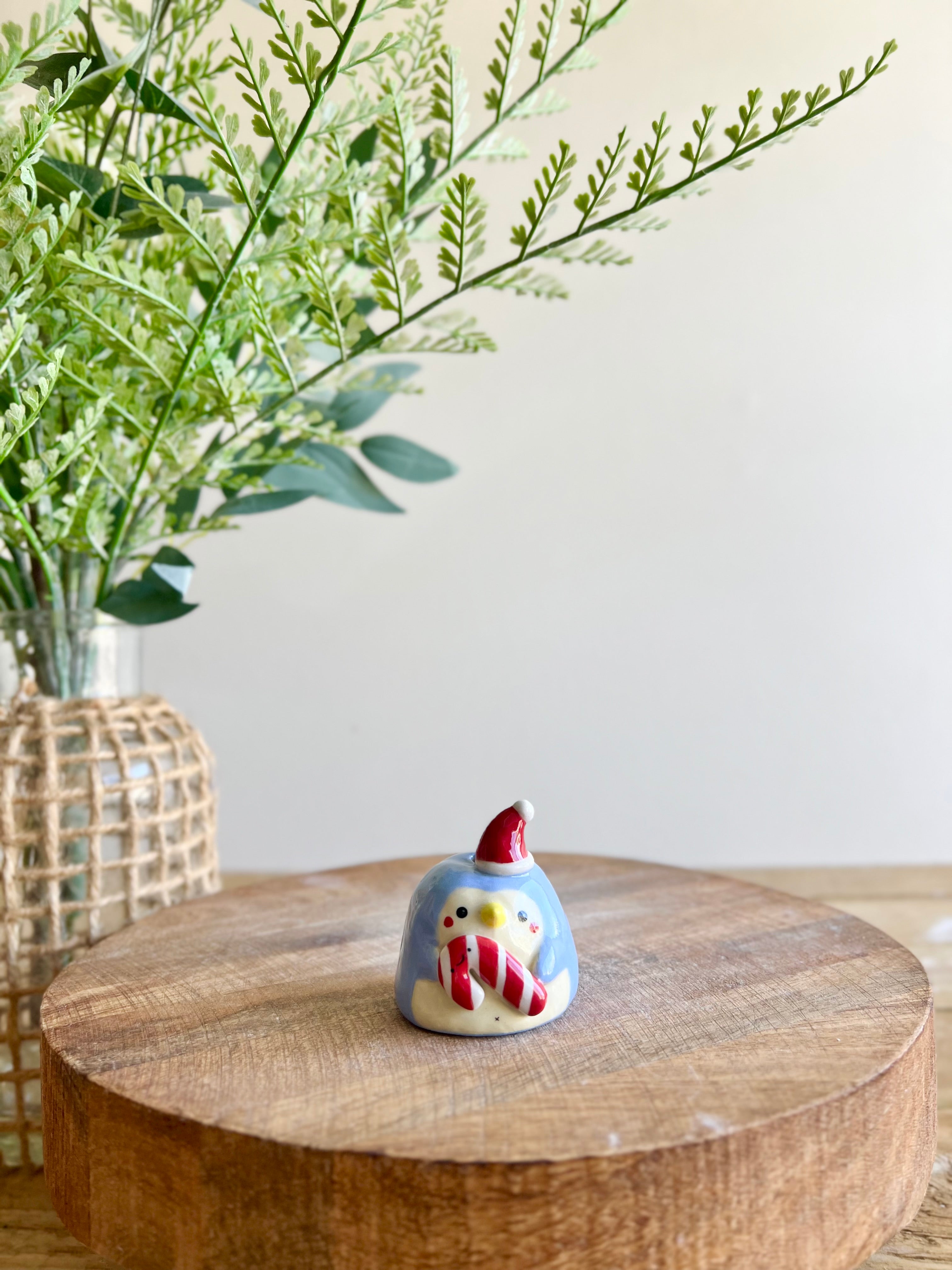 Mini festive penguin with candy cane friend bud vase