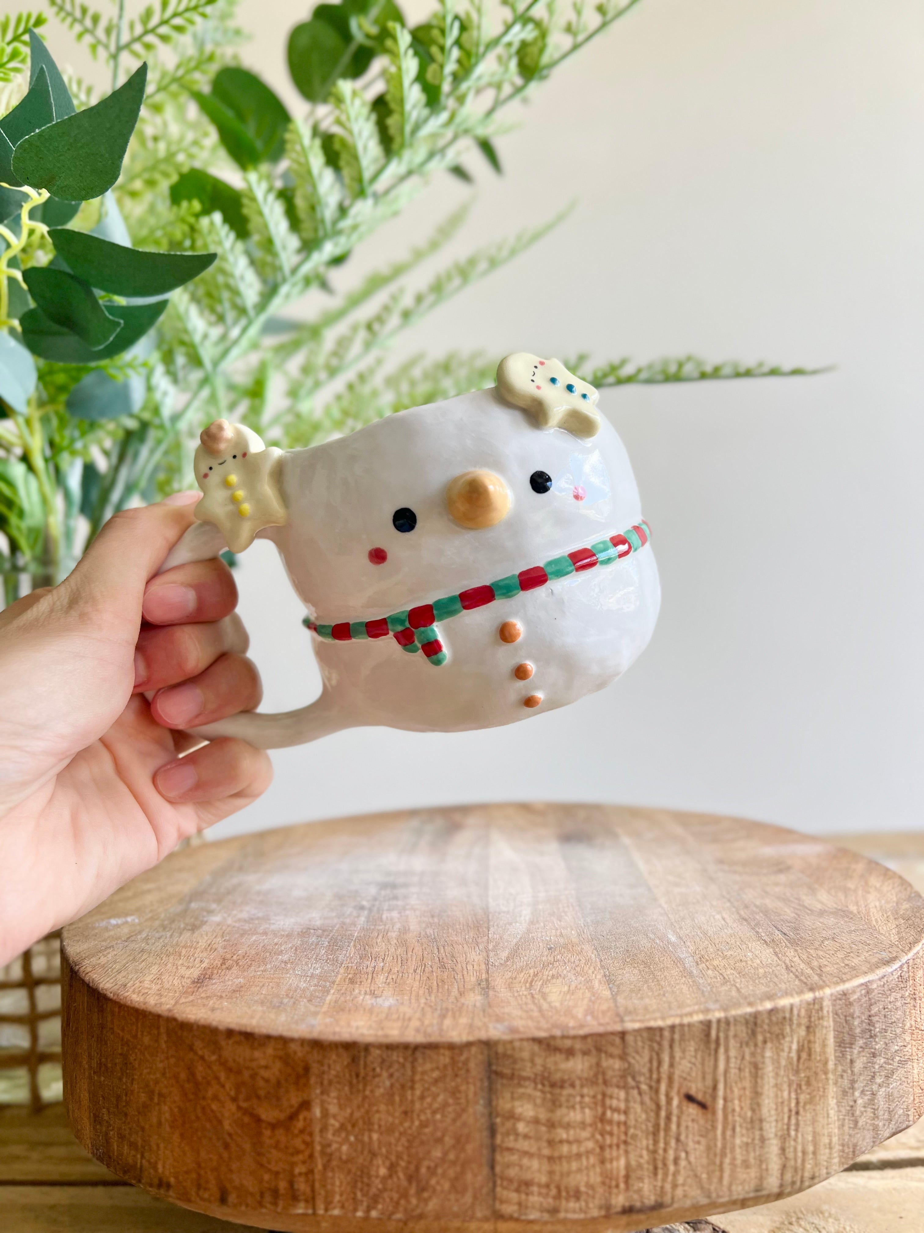 Snowman mug with gingerbread friends