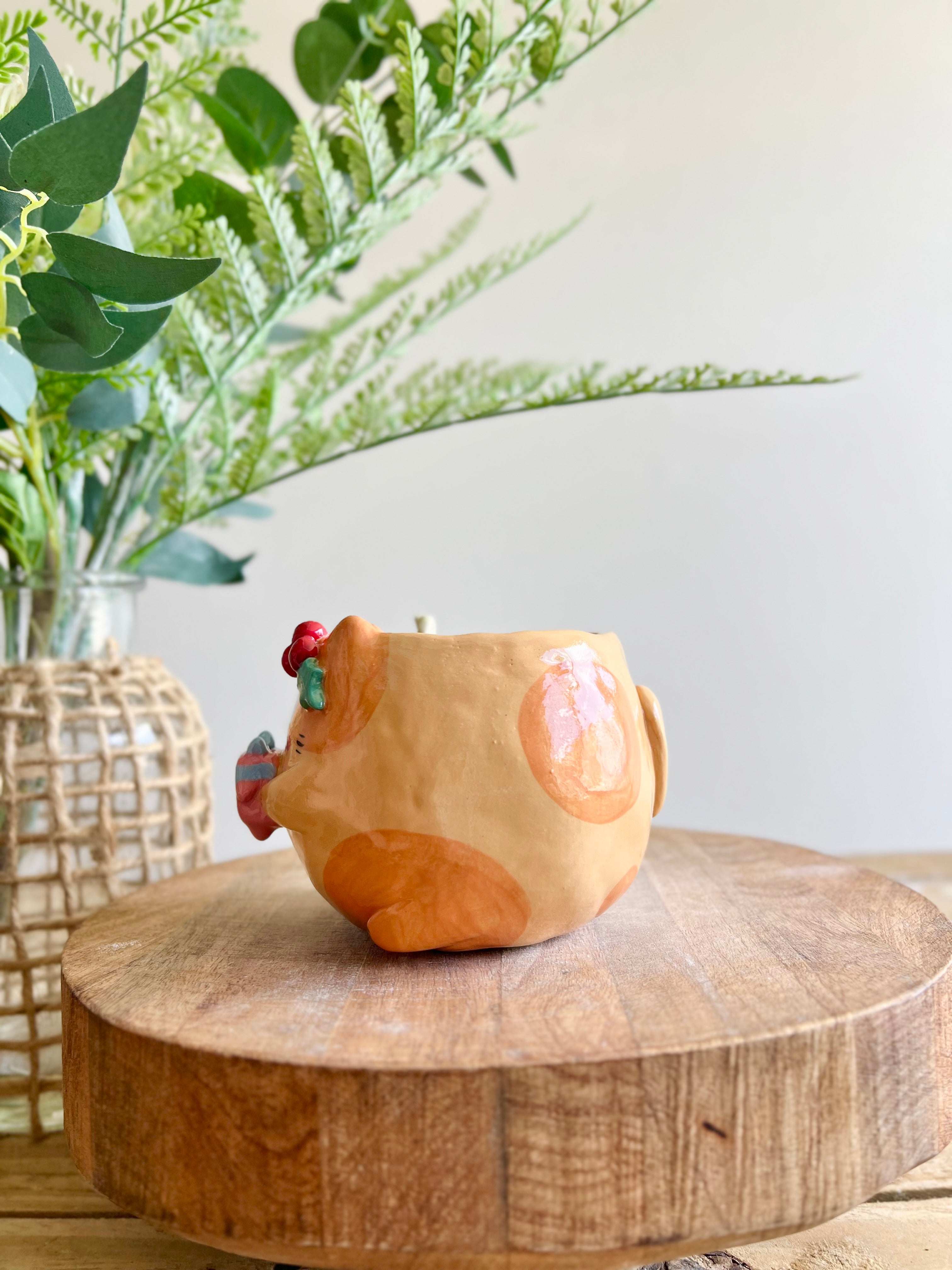 Festive gift bearing ginger cat mug with gingerbread friend