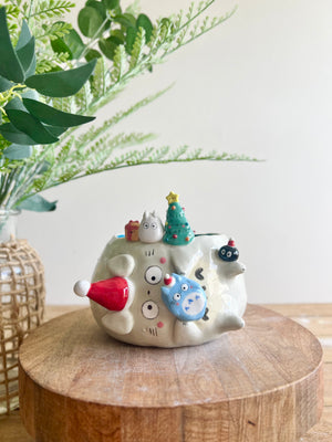 Festive sideways Totoro pot with Chibi Totoro friends