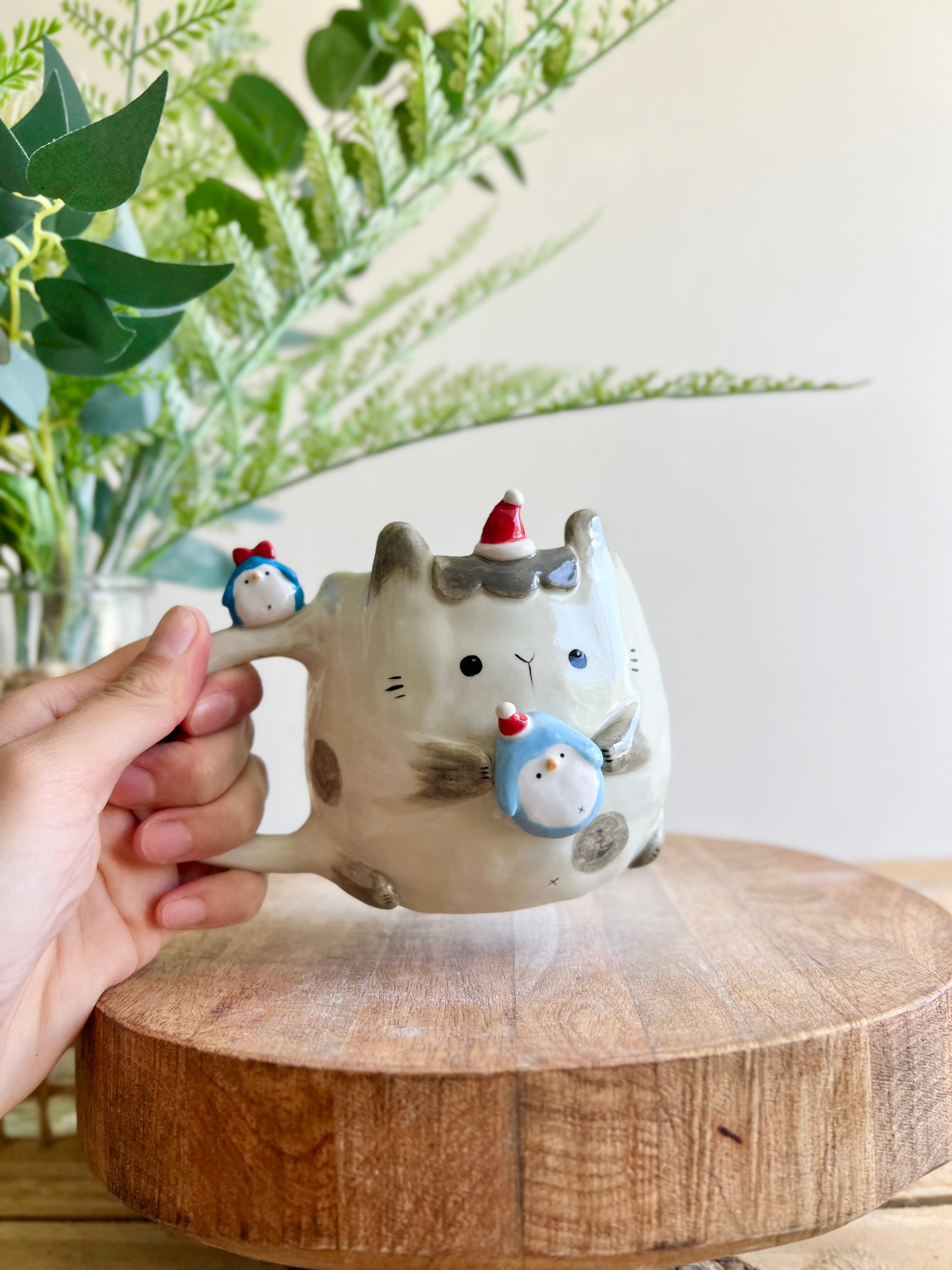 Festive bunny mug with penguin friends