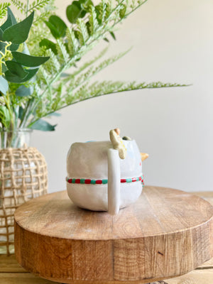 Snowman mug with gingerbread friends