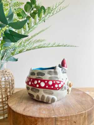 Festive grey cat pot with gingerbread friend