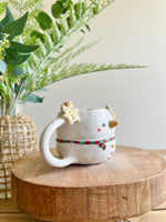 Snowman mug with gingerbread friends