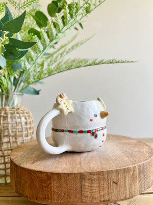 Snowman mug with gingerbread friends