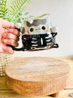 Skeleton kitty mug with cat skull friends