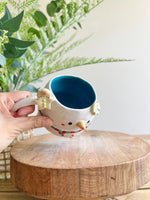 Snowman mug with gingerbread friends