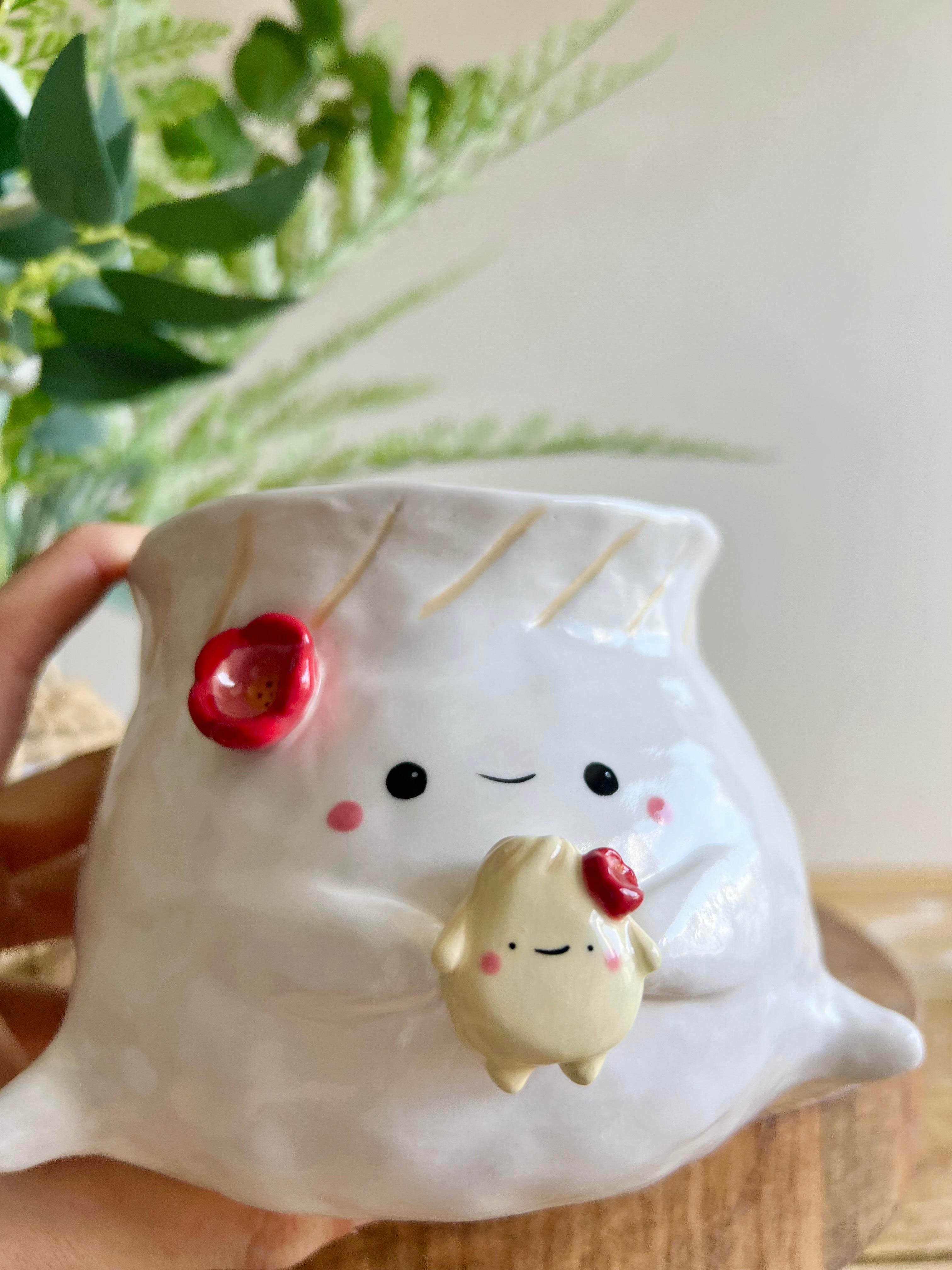 Flowery dumpling pot with baby dumpling