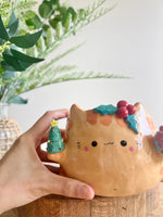 Gift bearing festive Ginger cat pot with Christmas tree friend