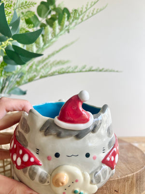 Festive grey cat pot with gingerbread friend