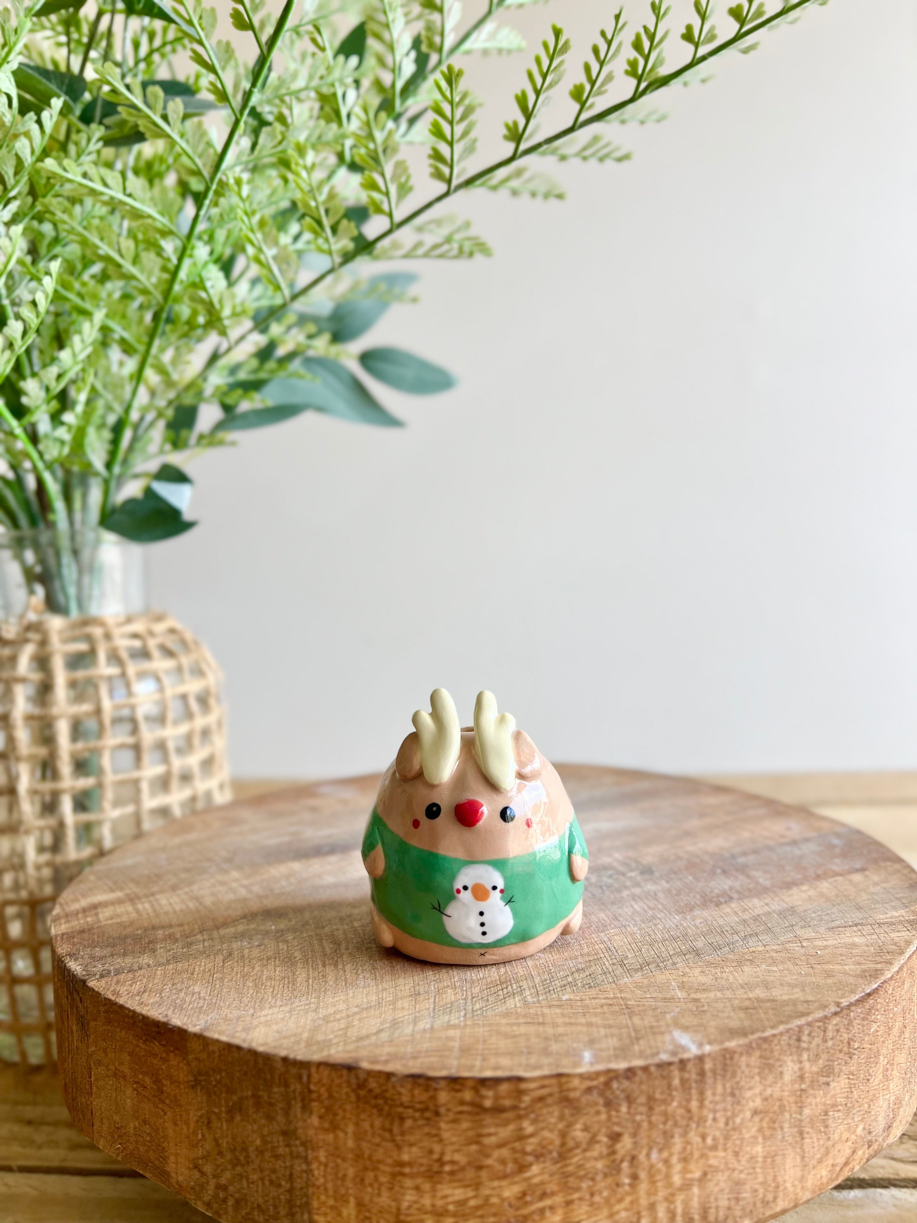 Green Christmas sweater reindeer bud vase