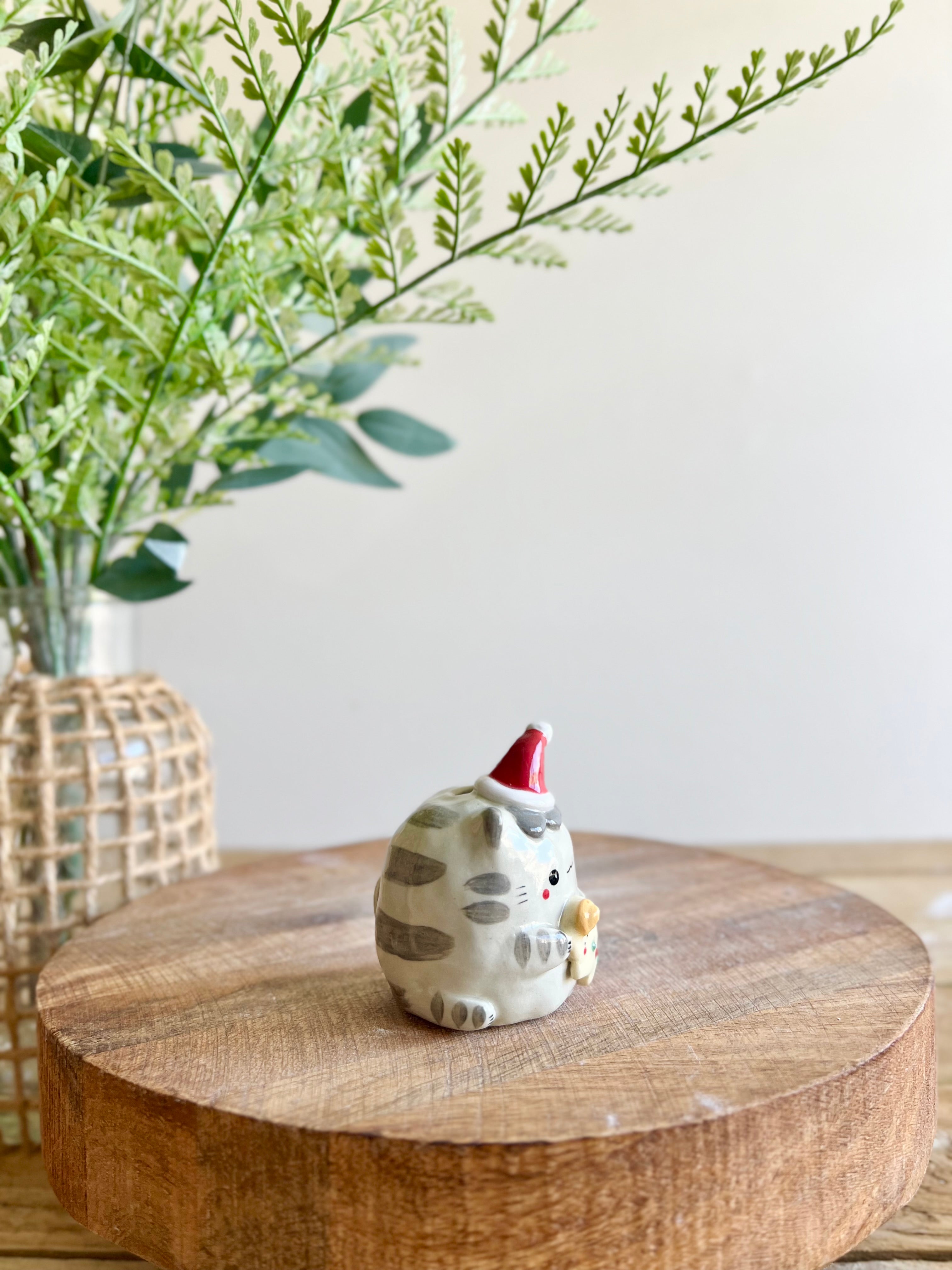 Festive grey cat with gingerbread friend bud vase