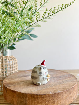 Festive grey cat with gingerbread friend bud vase