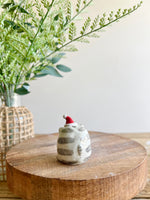 Festive grey cat with gingerbread friend bud vase