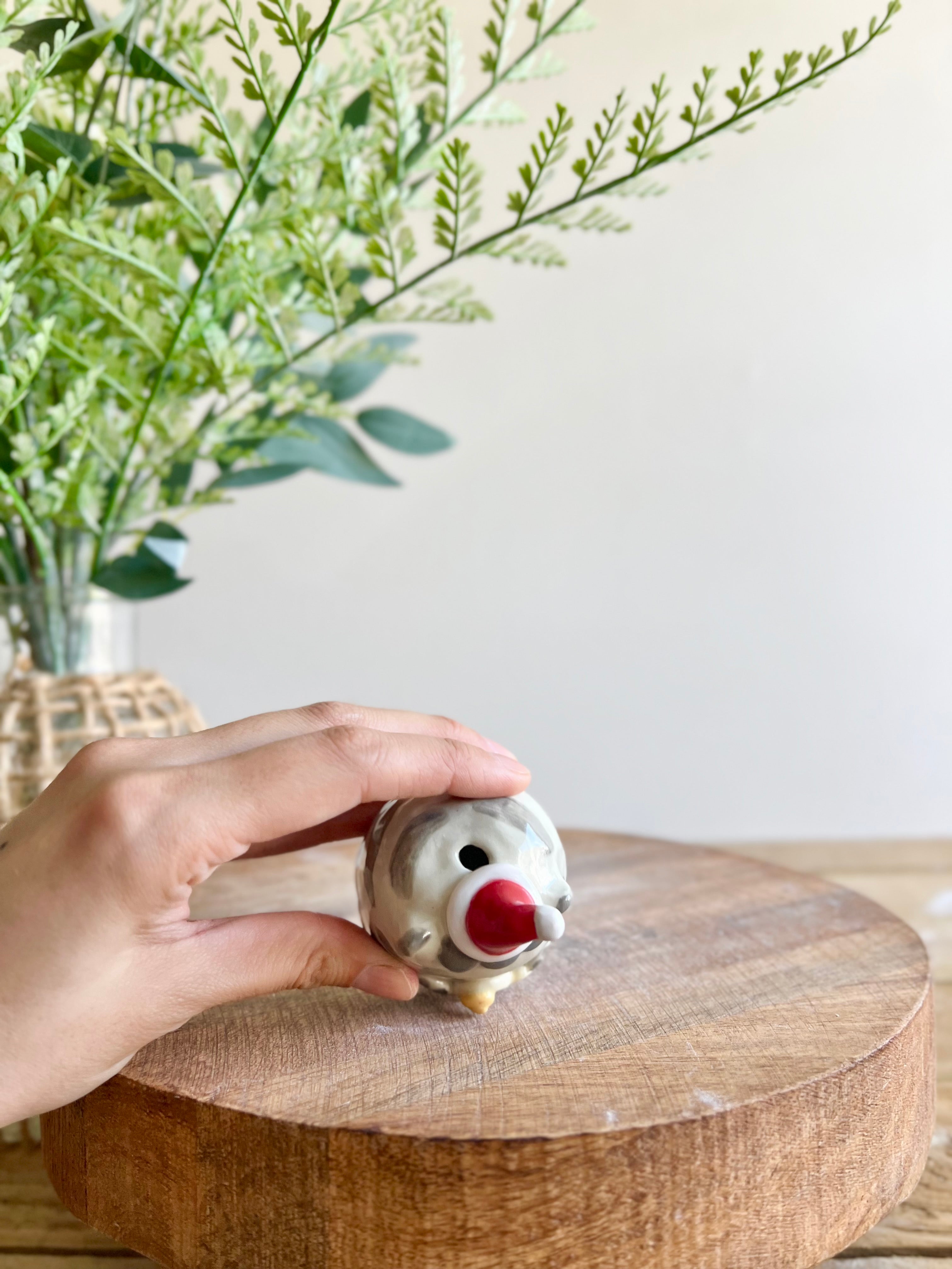 Festive grey cat with gingerbread friend bud vase