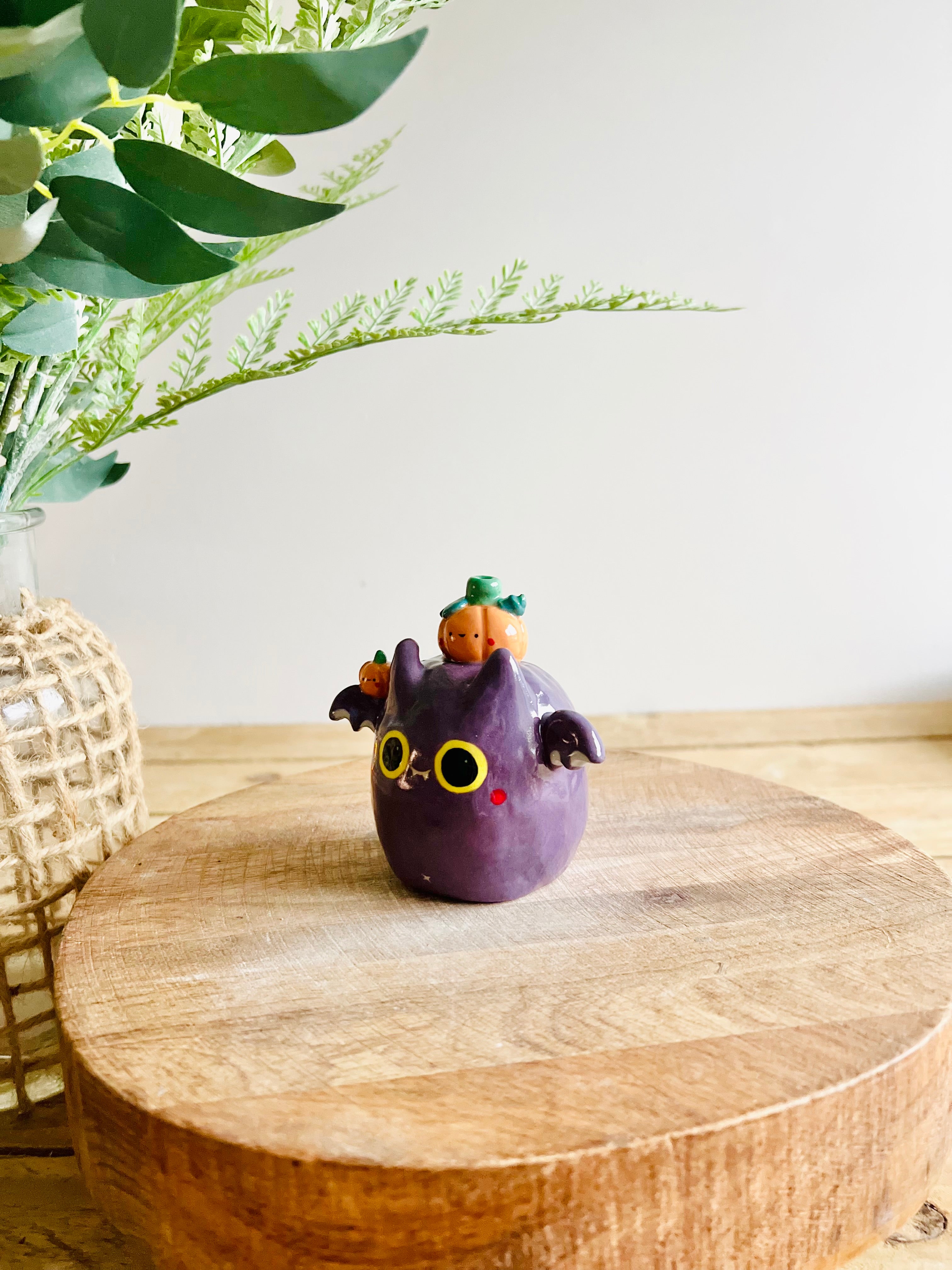 Bat with pumpkin friends bud vase