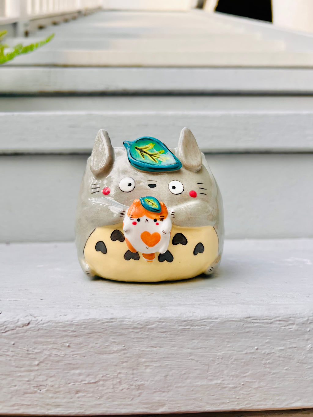 Totoro pot with cat friend