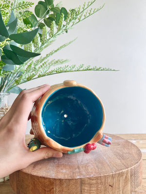 Gift bearing festive Ginger cat pot with Christmas tree friend