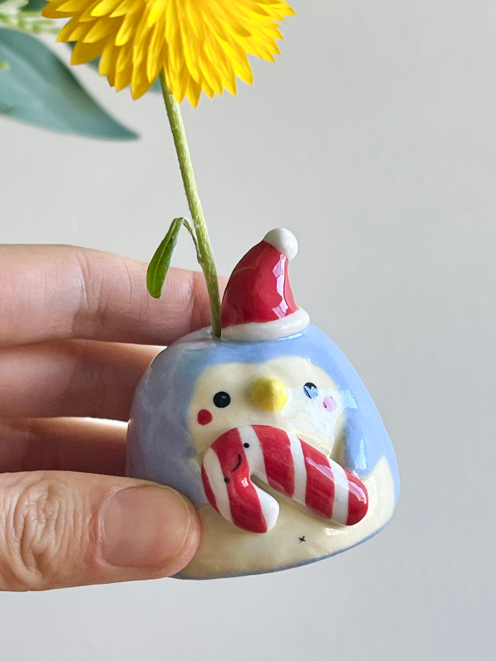 Mini festive penguin bud vase with candy cane friend, photo 9 of 9