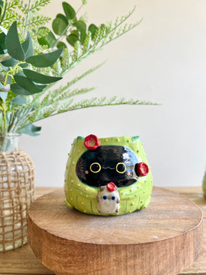 Flowery black CAT-us pot with grey cat friend