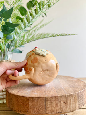 Ginger cat mug with gingerbread and present friend