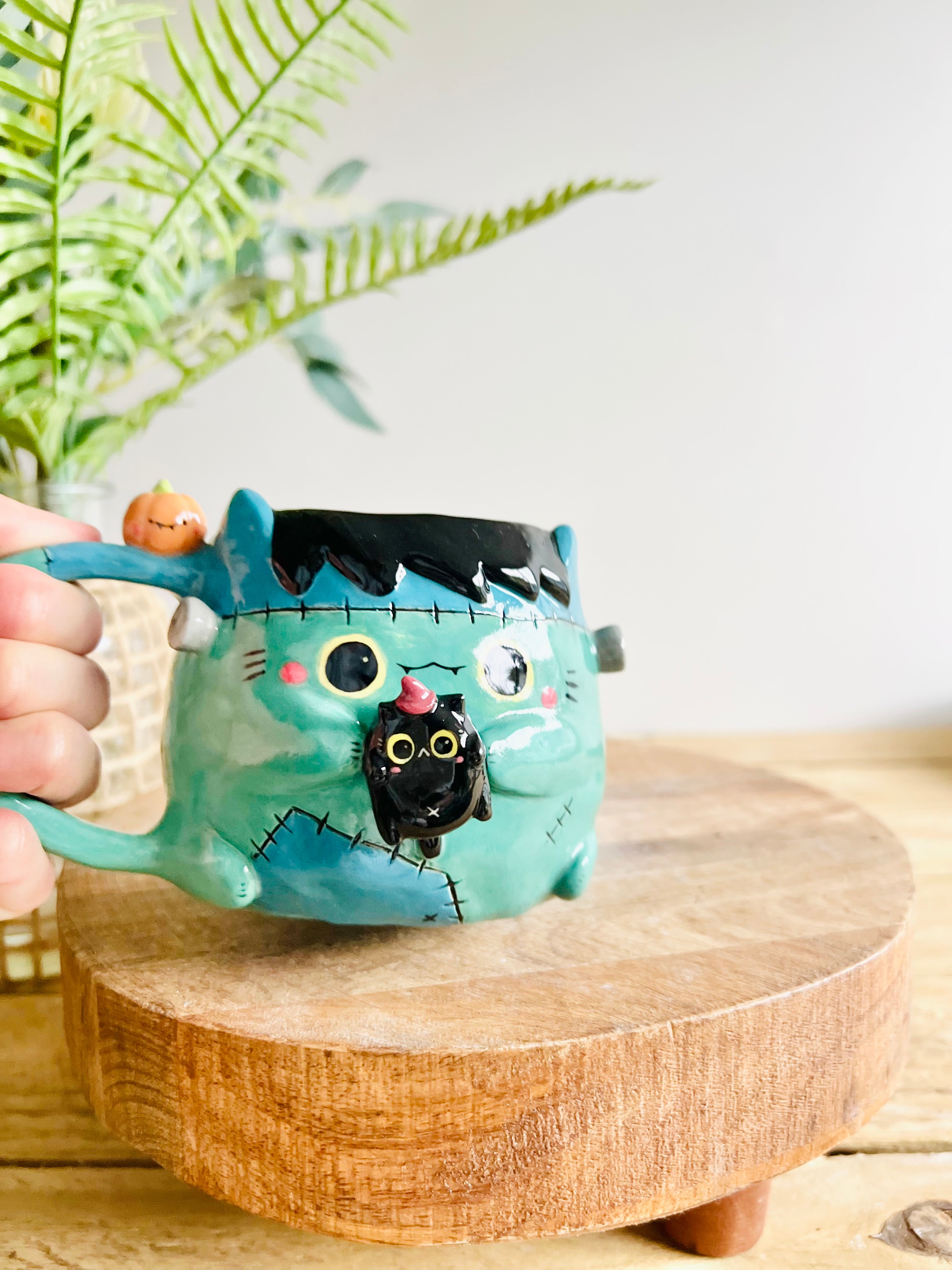 Franken-kitty mug with black cat friend