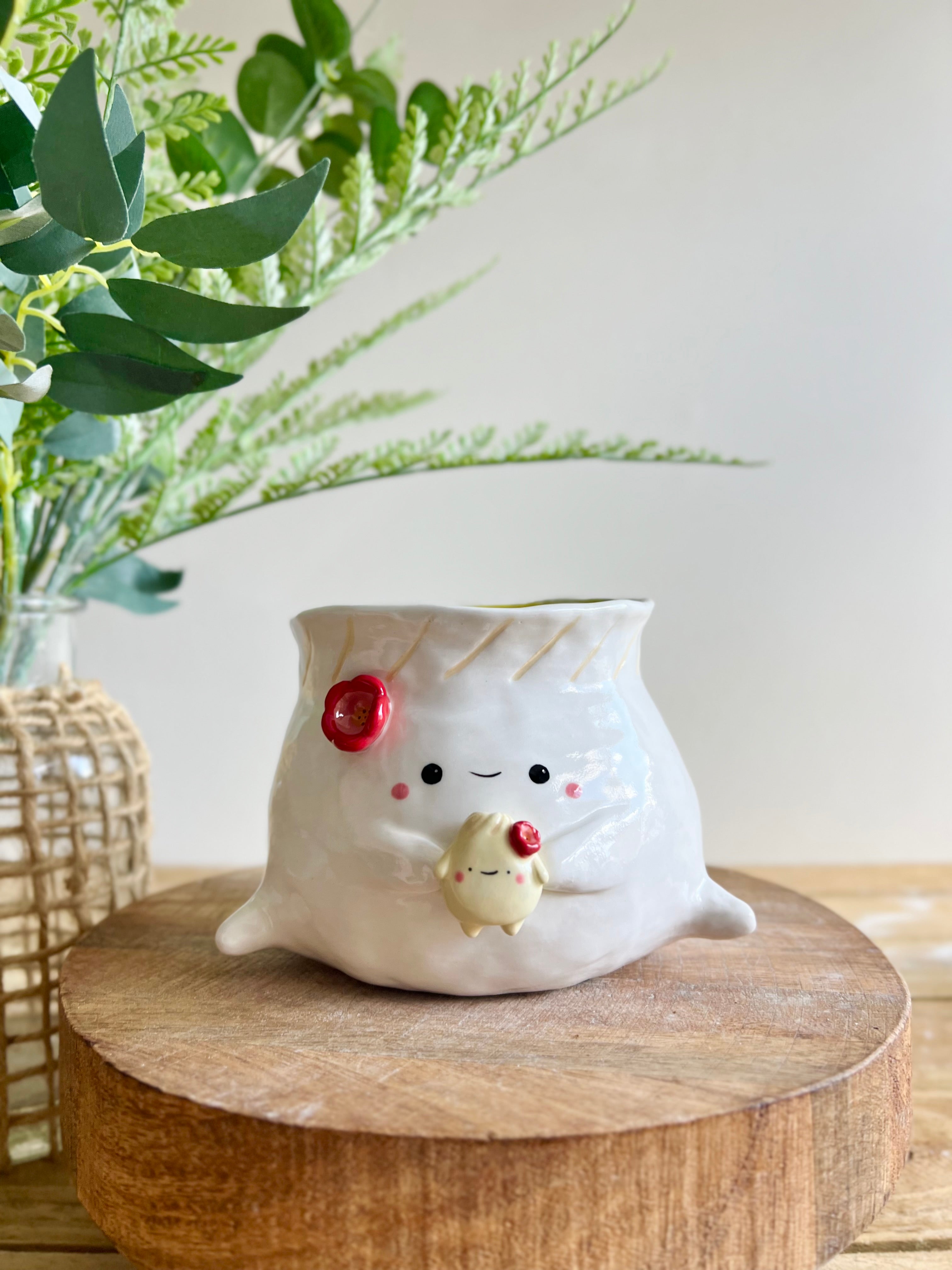 Flowery dumpling pot with baby dumpling