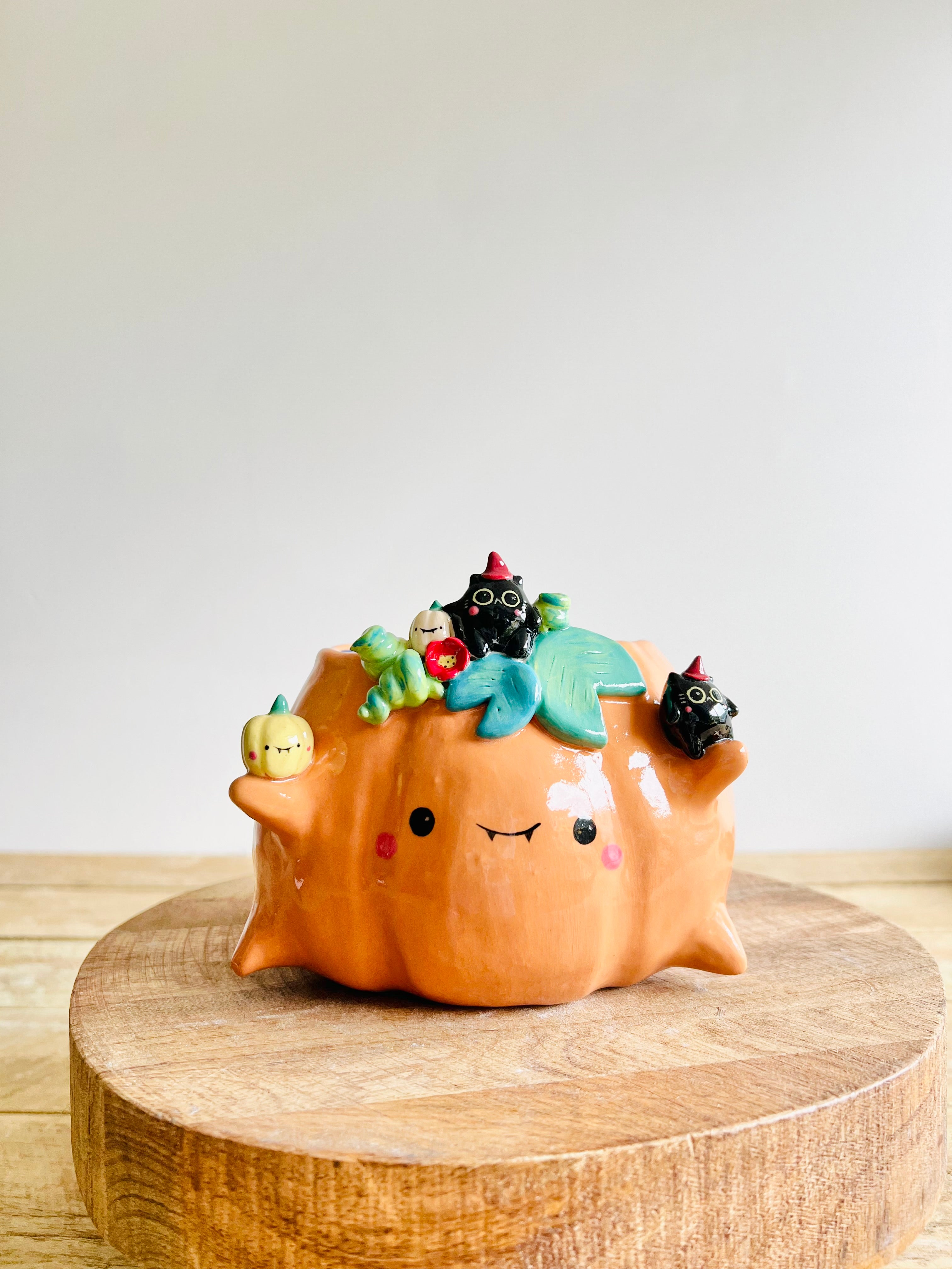 Pumpkin pot with black cat and baby pumpkin friends