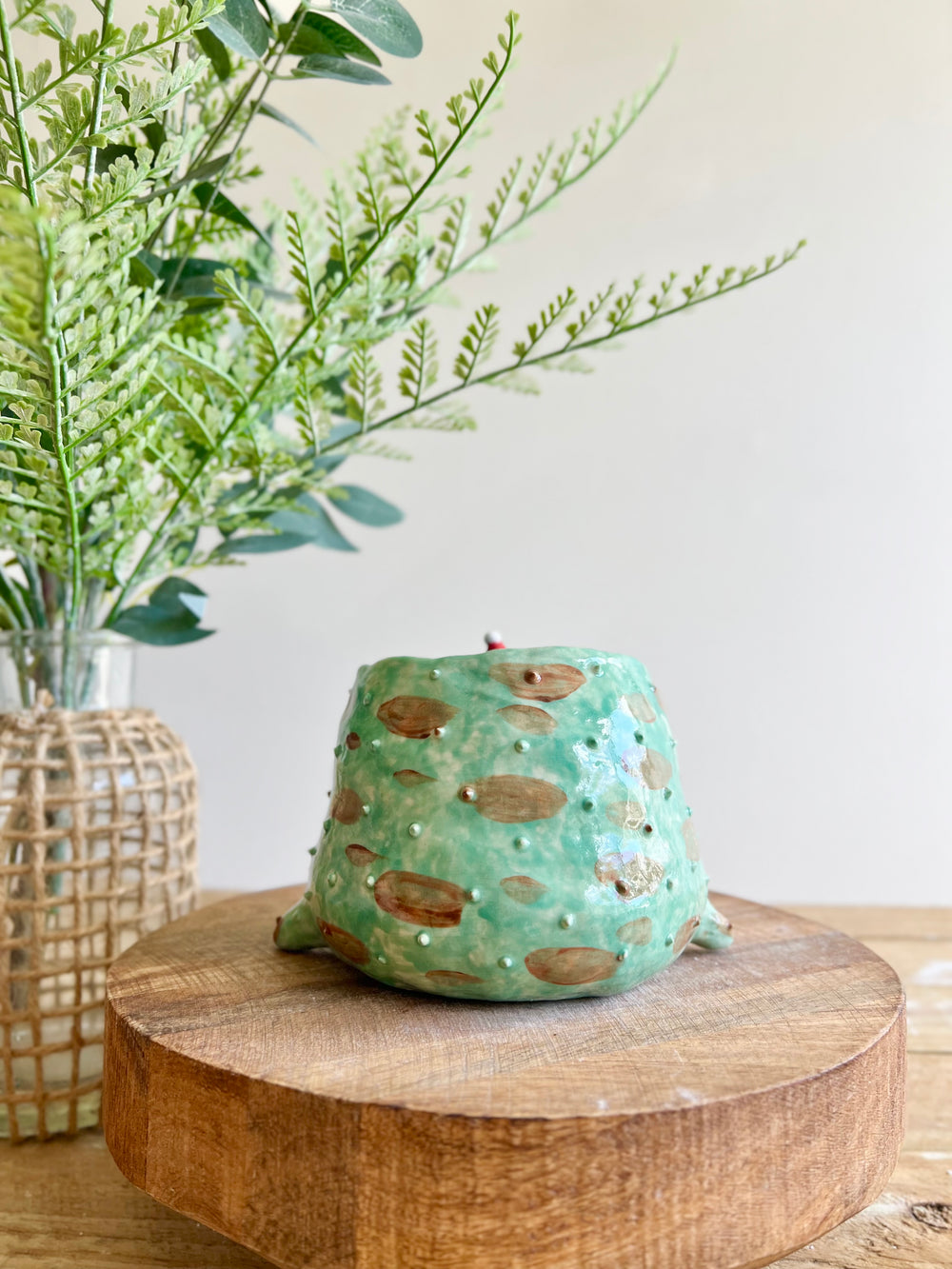 Festive grumpy Froggo planter bearing gift, photo 5 of 15