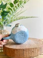 Festive Penguin mug with baby penguin and cat friend