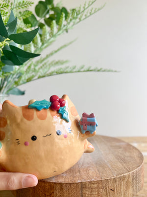 Gift bearing festive Ginger cat pot with Christmas tree friend