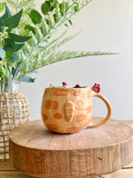 Ginger cat mug with gingerbread and present friend