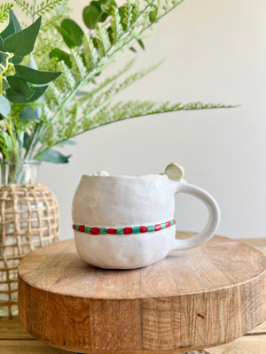 Snowman mug with gingerbread friends