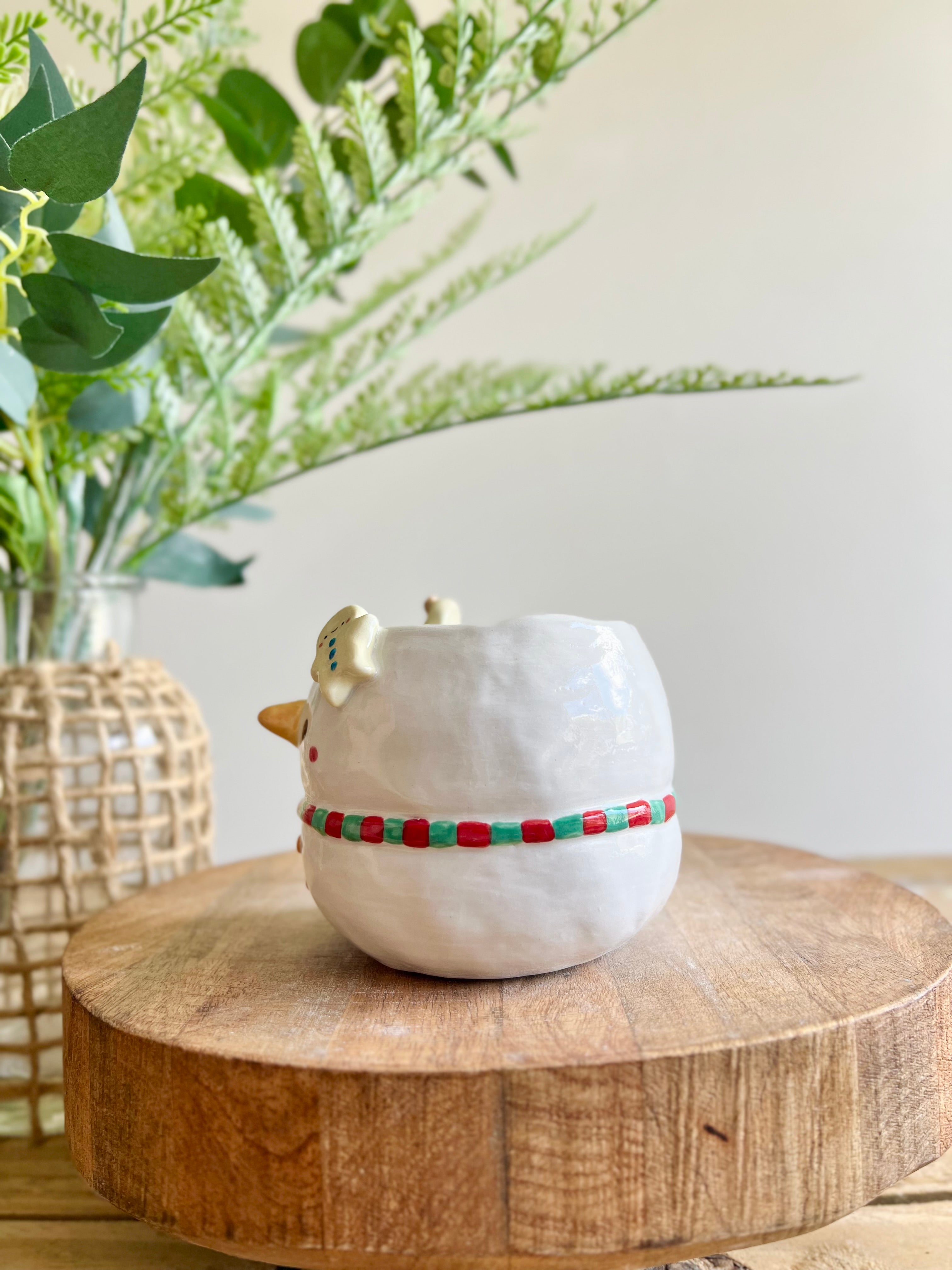 Snowman mug with gingerbread friends