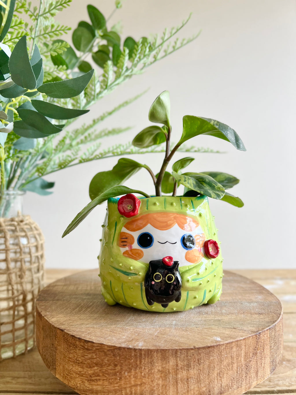 Flowery ginger CAT-us pot with black cat friend