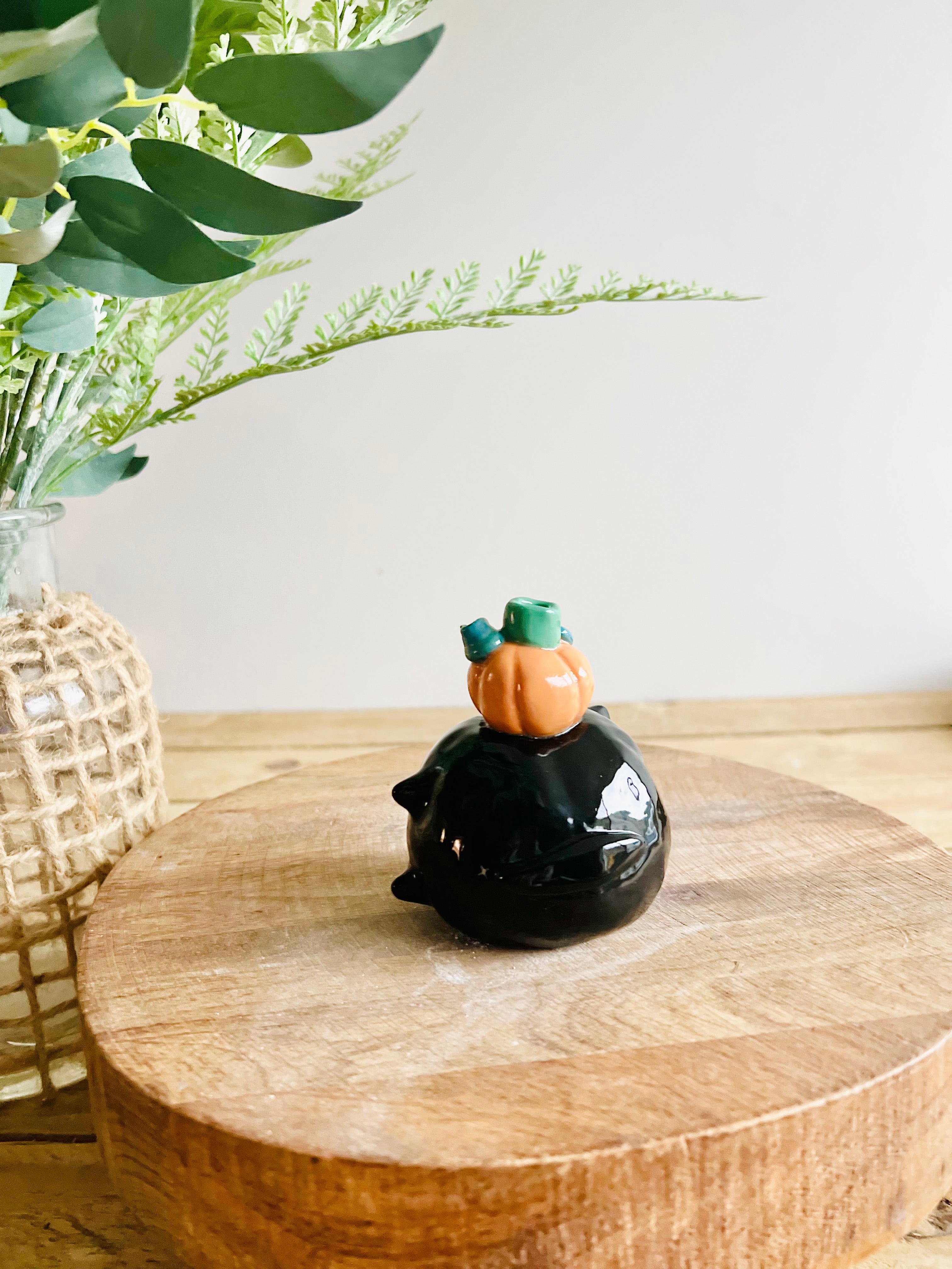 Sideways black cat with ghost and pumpkin friend bud vase