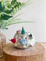 Festive sideways Totoro pot with Chibi Totoro friends