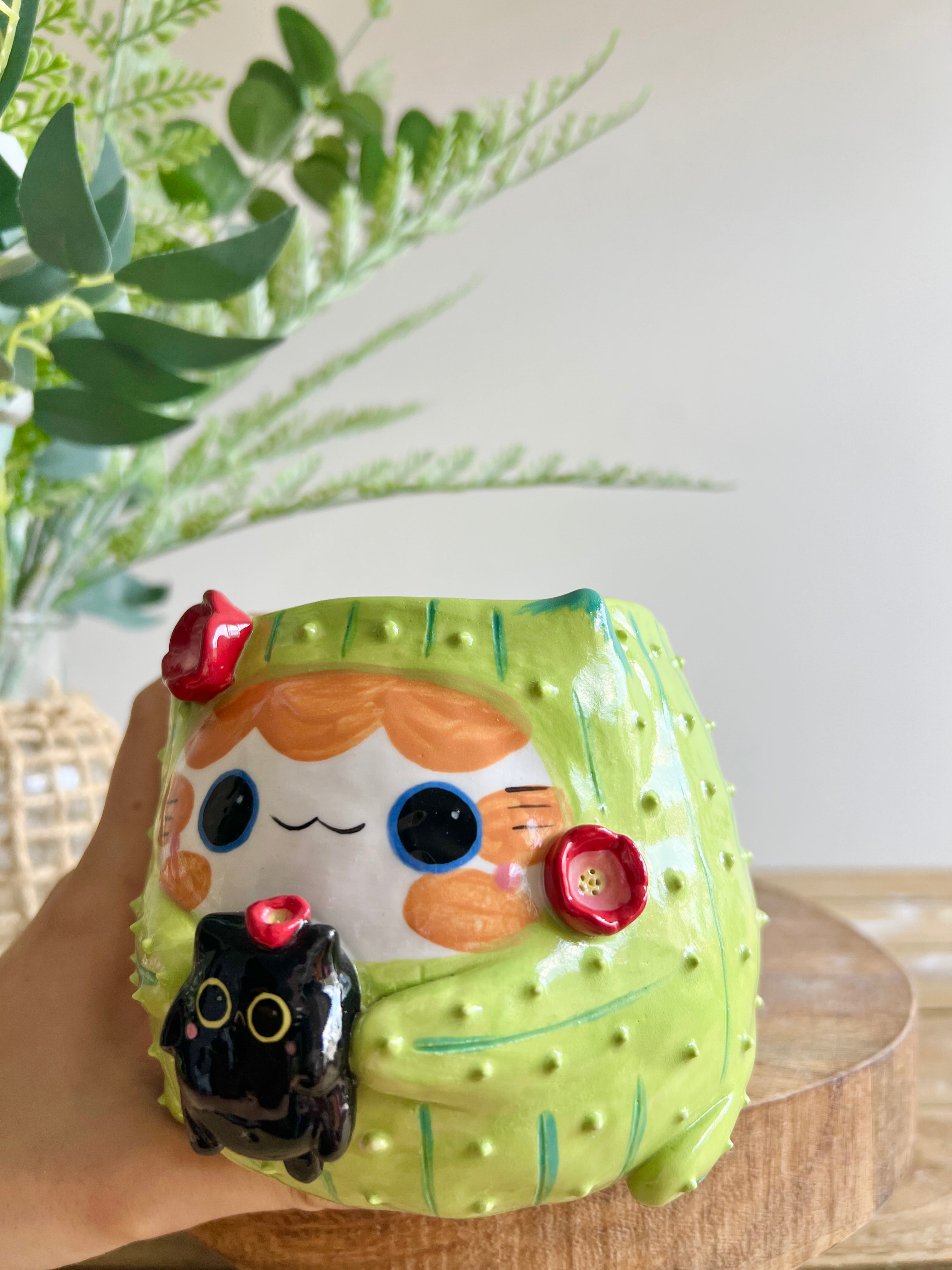 Flowery ginger CAT-us pot with black cat friend