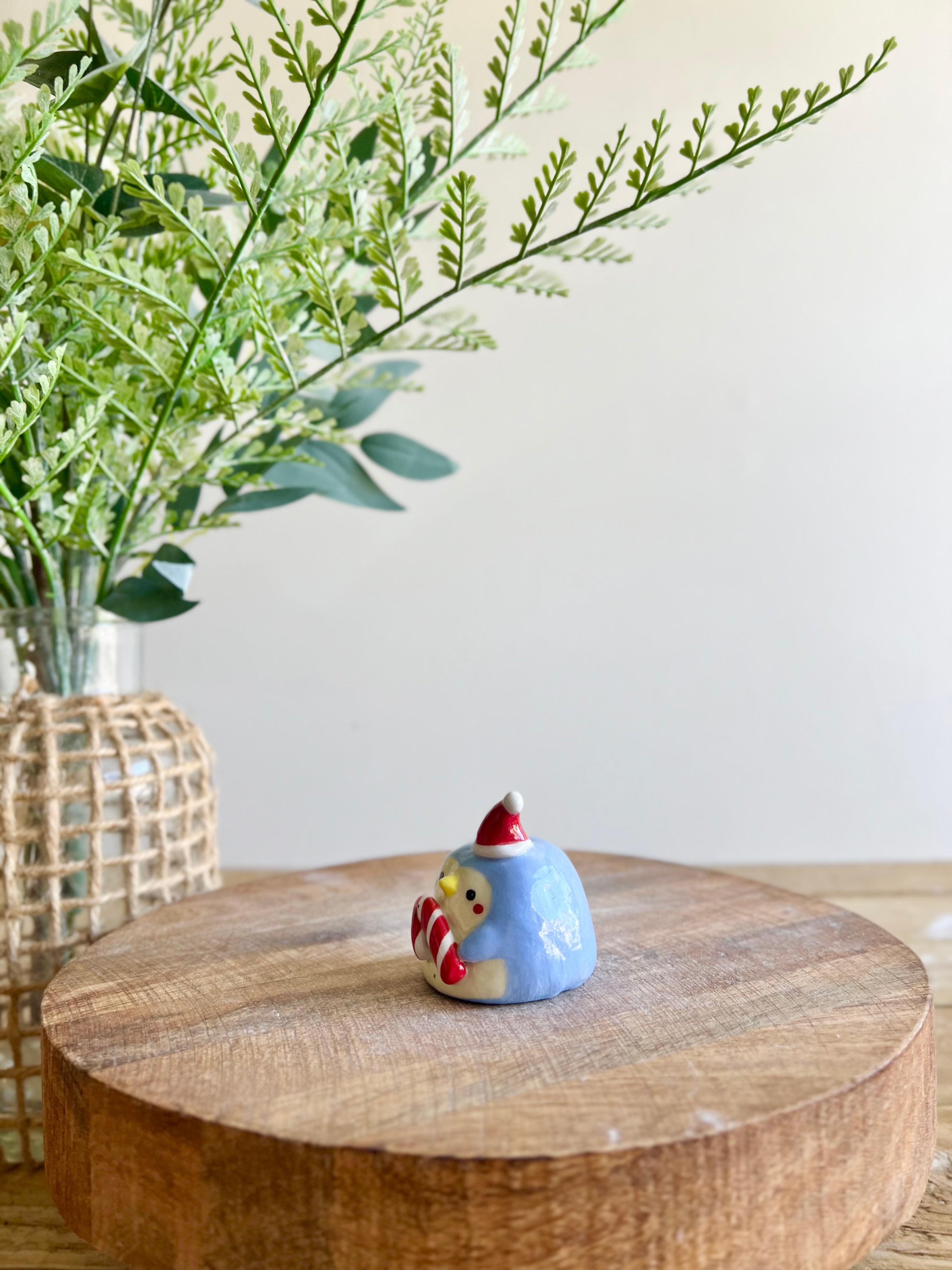 Mini festive penguin with candy cane friend bud vase