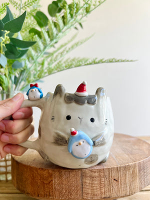 Festive bunny mug with penguin friends