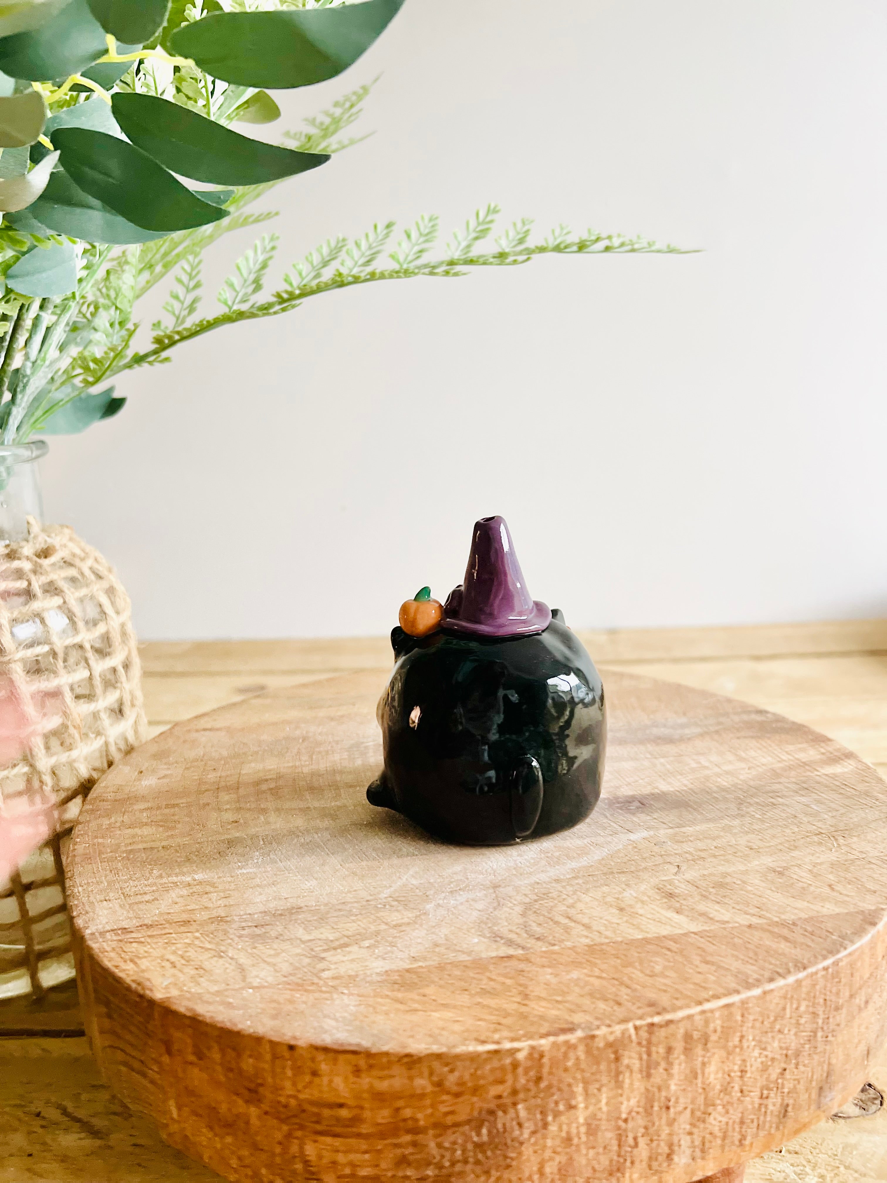 Black cat witch with broomstick and pumpkin friend bud vase