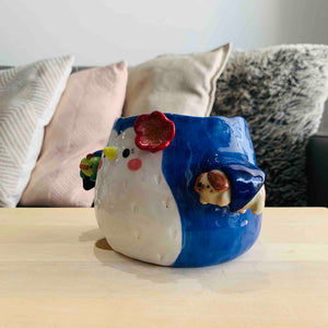 Flowery Penguin Pot with Fish and Armpit Doggo Friend