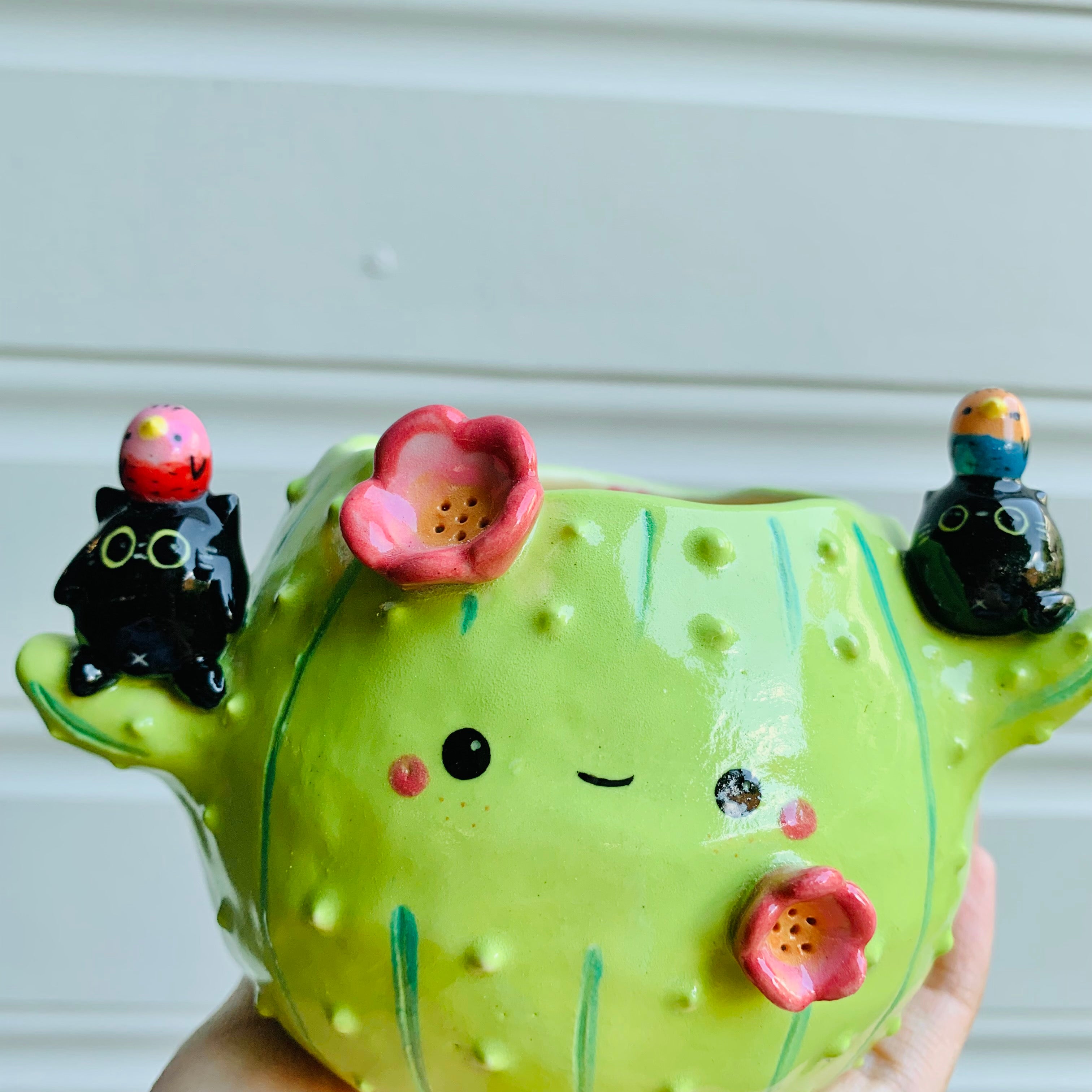 Flowery cactus pot with black cats and bird friends