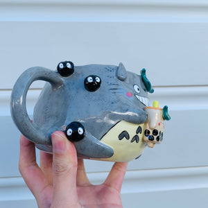 Smiling Totoro with bubble tea mug