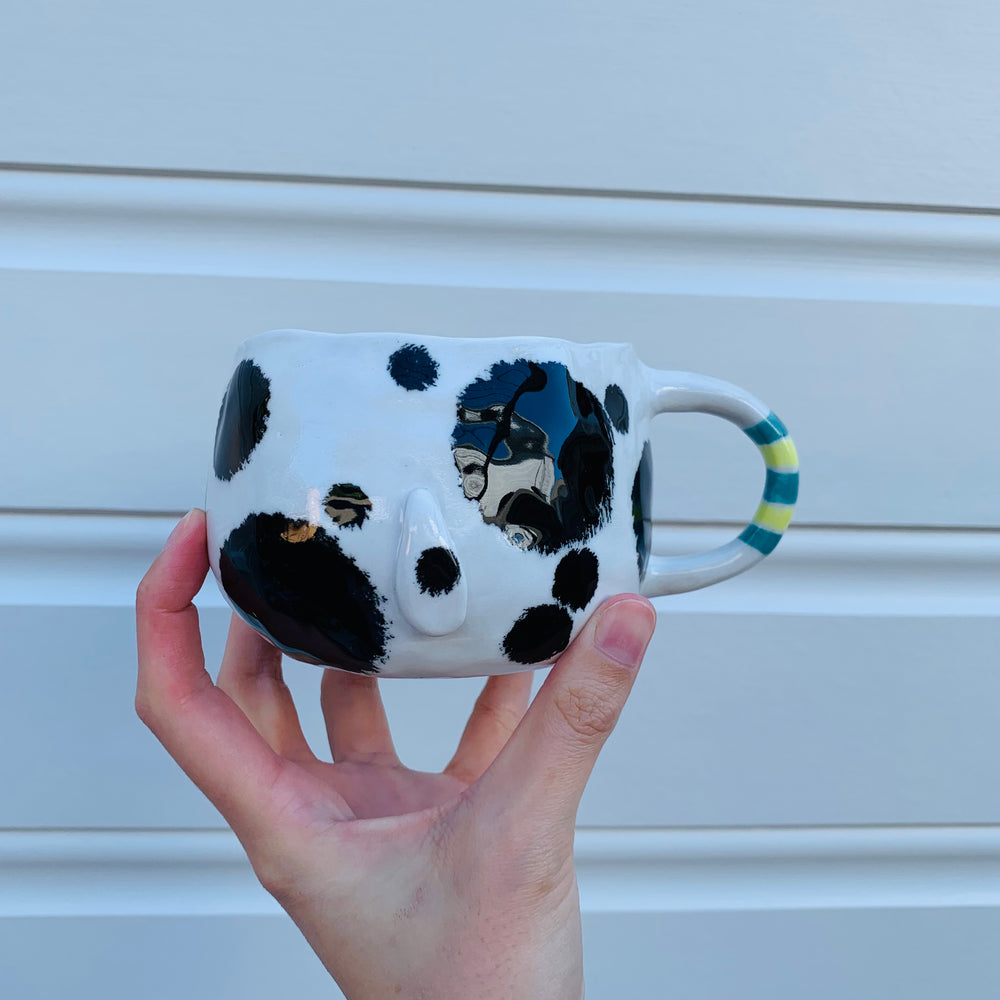 Black and white spotty doggo with bubble tea mug, photo 9 of 10